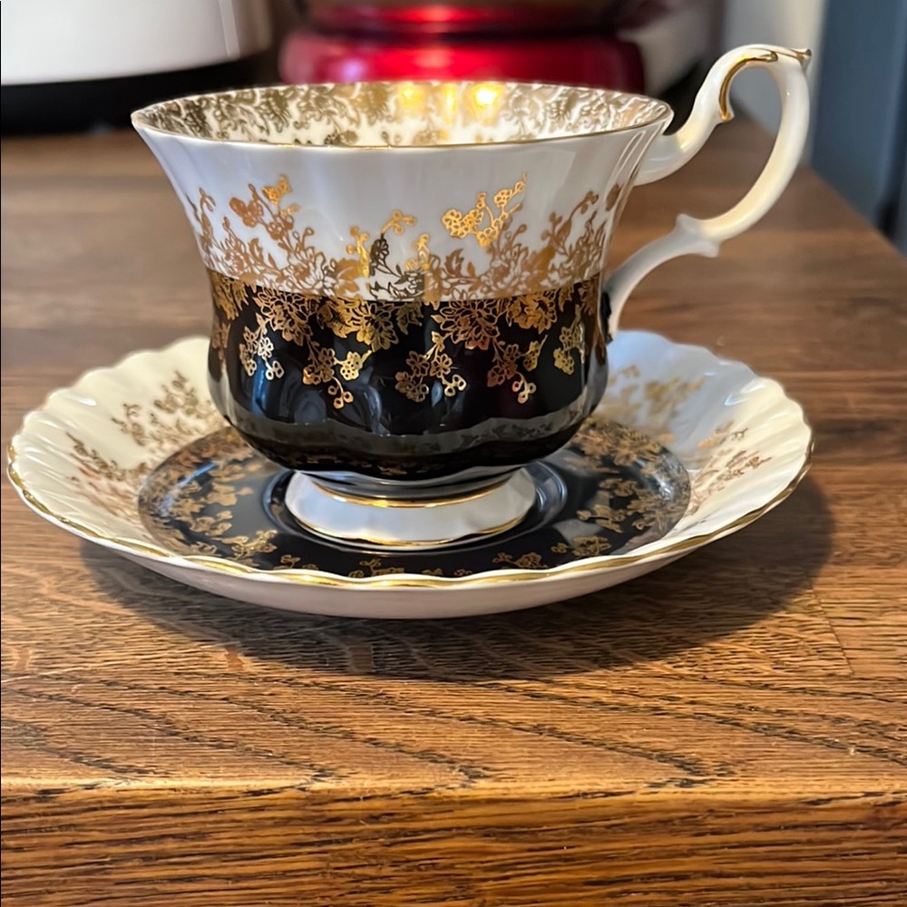 Elegant Black and Gold Teacup and Saucer Set